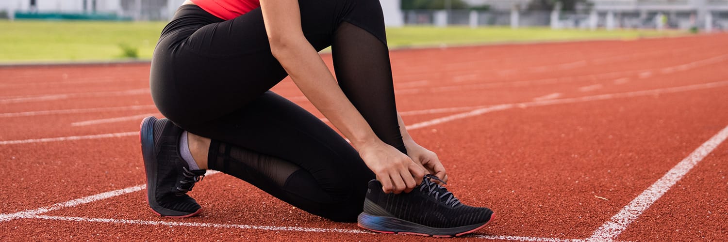 Löpare på idrottsplats
